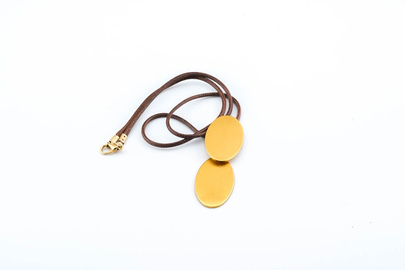 Dynamic Gold Oval Pendant Necklace